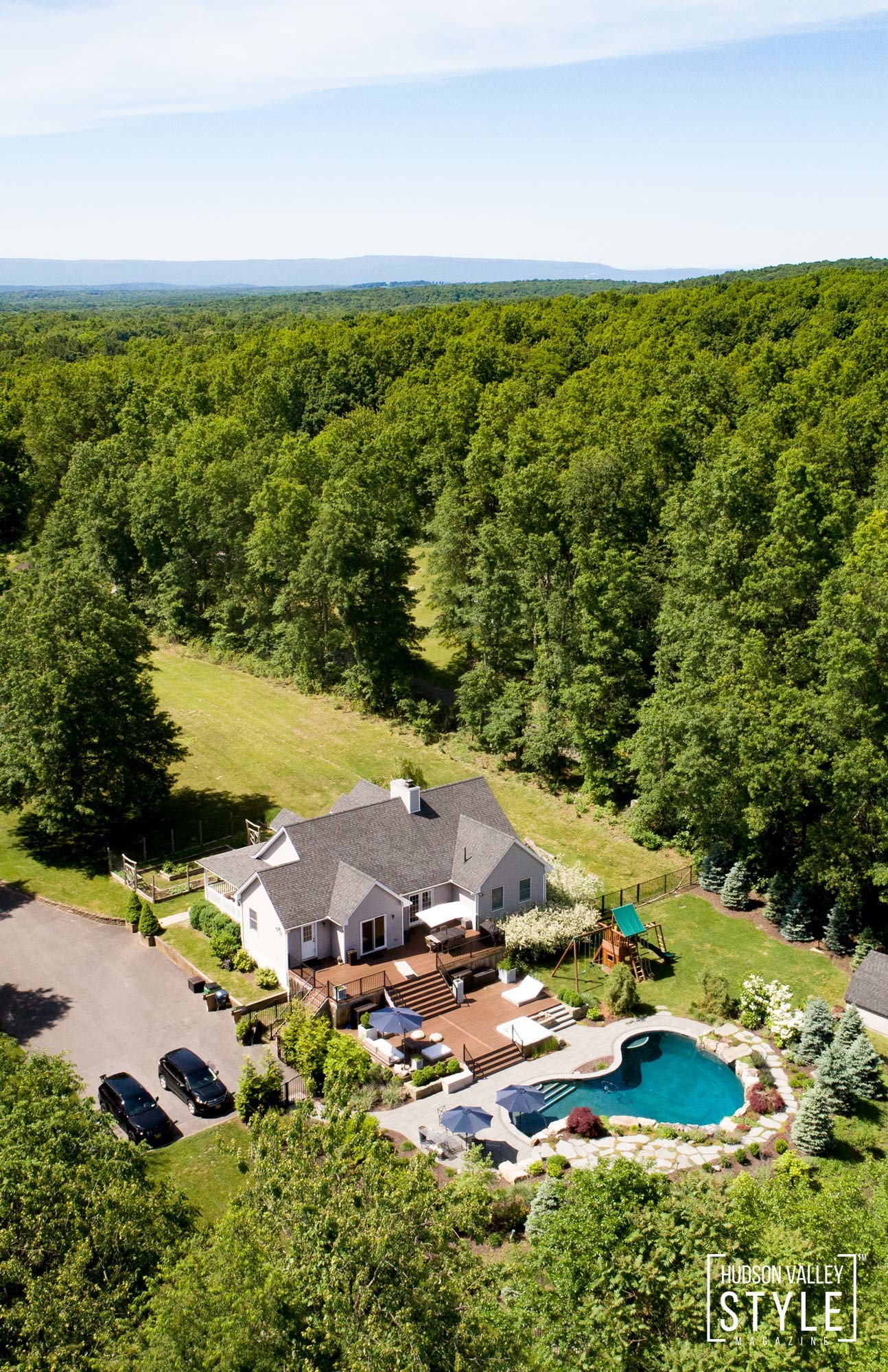A beautiful Hudson valley Home for Sale with a heated pool, jacuzzi, 4 acres of private ATV and hiking trails and amazing modern rustic kitchen