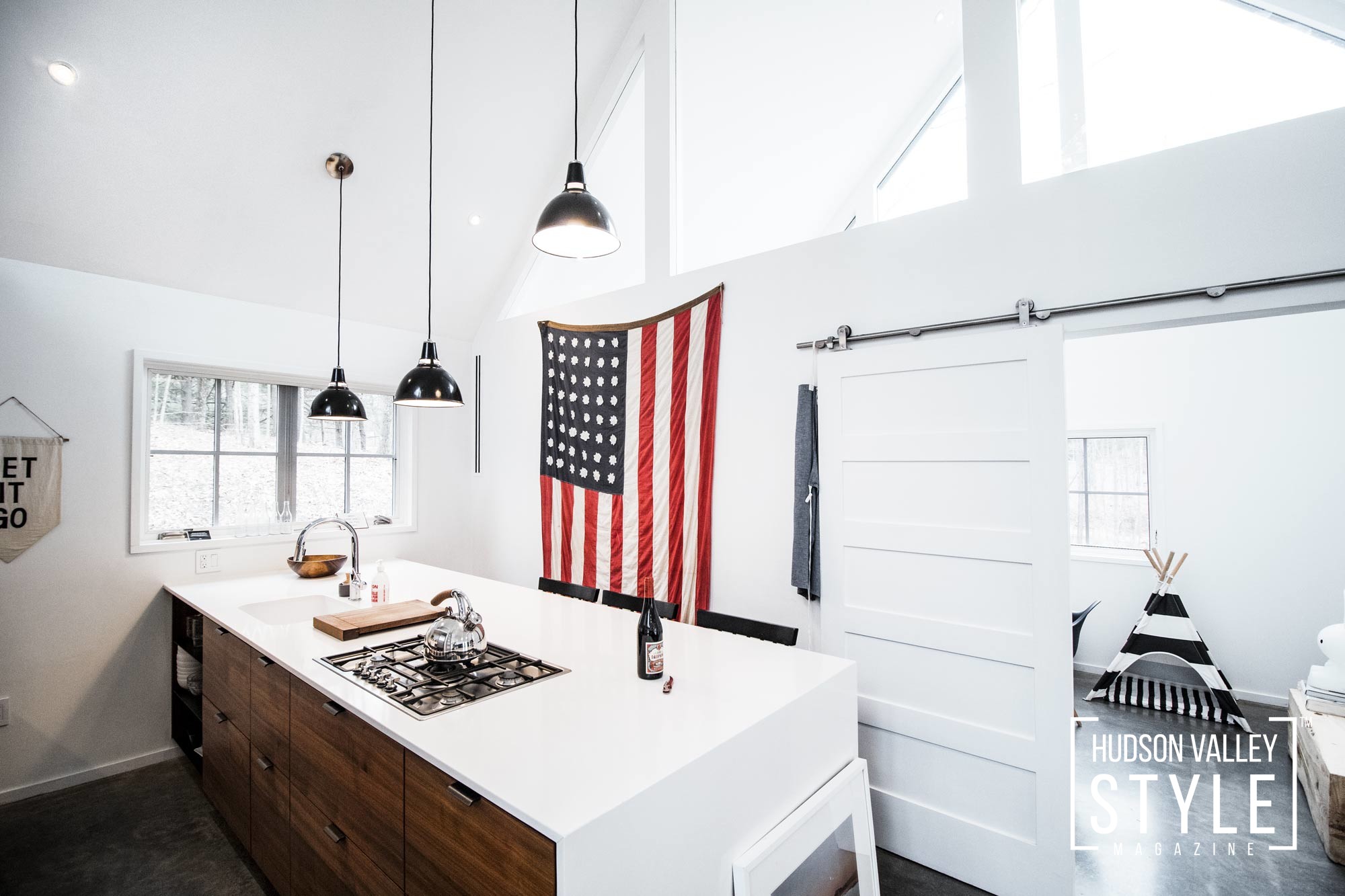 Pendant lights, white walls, american flag, white countertops